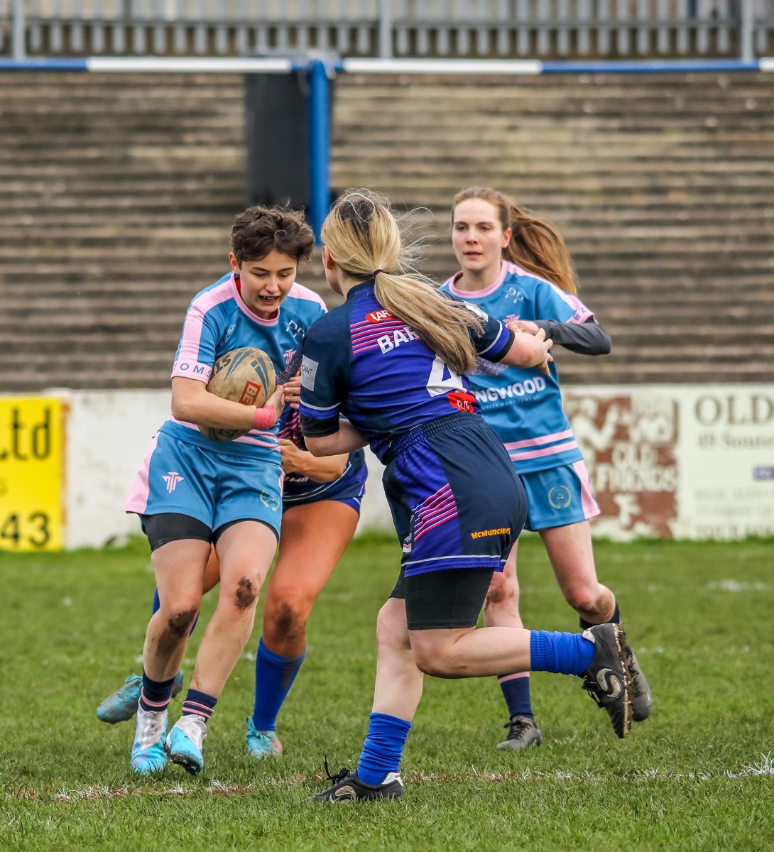An Atoms women’s player carrying the ball in a match